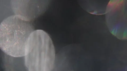 Close-up of silver bokeh and prism on black background Video stock 318368250