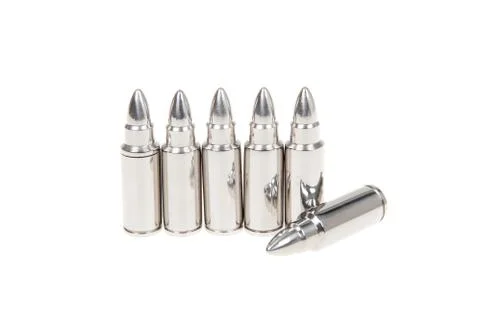Close up of silver bullets in a row, isolated on white Stock Photos