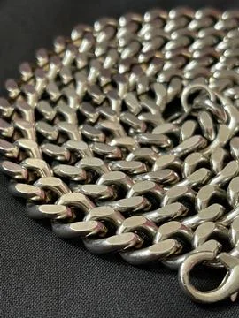 Close up of a silver chain texture on black background Stock Photos