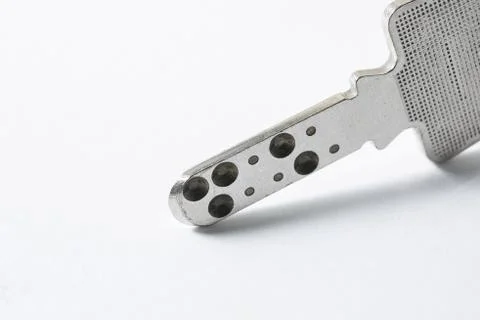 Close up of Silver key on white background Stock Photos