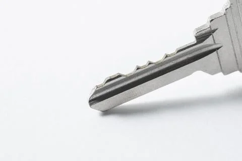 Close up of Silver key on white background Foto stock
