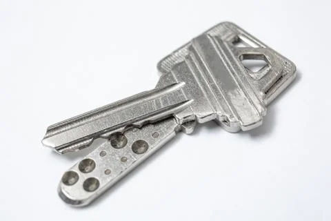Close up of Silver key on white background Foto stock