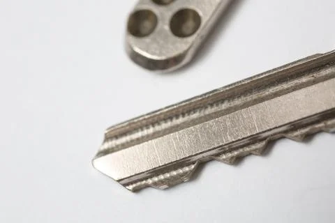 Close up of Silver key on white background Foto stock