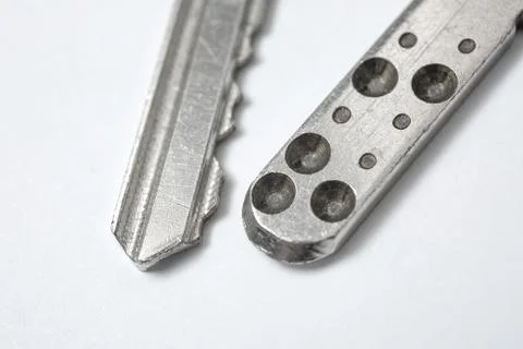 Close up of Silver key on white background Stock Photos
