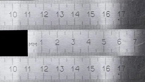 Close-up of a silver metal ruler Stock Footage 327442405