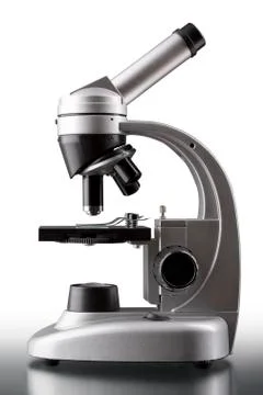 Close up of a silver microscope, with white background Foto stock