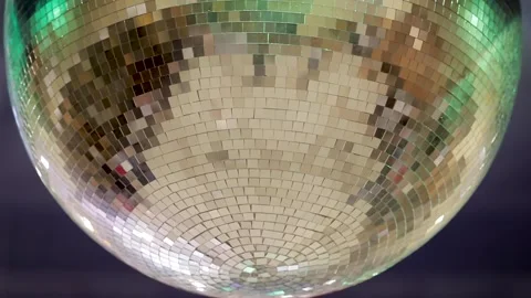 Close up of silver mirror disco ball with bright rays, party, blurred background Stock Footage 234917364