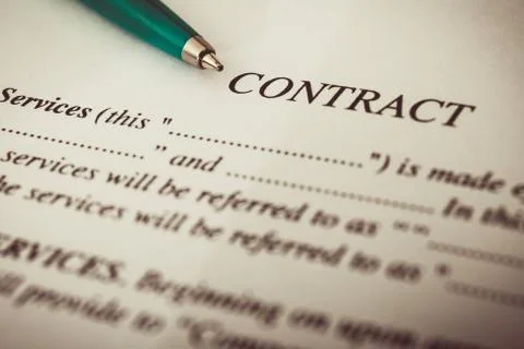 Close-up of silver pen on contract. Stock Photos