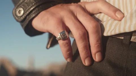 Close-up of a silver ring on the little finger of a man's hand. The hand of a Stock Footage 220668481