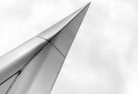 Close up of a silver triangular steel on a neutral background. 스톡 사진