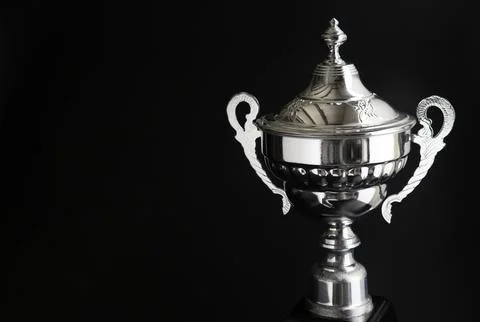 Close up of Silver trophy over black background. Winning awards with copy s.. Foto stock