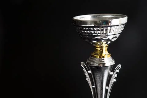 Close up of Silver trophy over black background. Winning awards with copy s.. Foto stock
