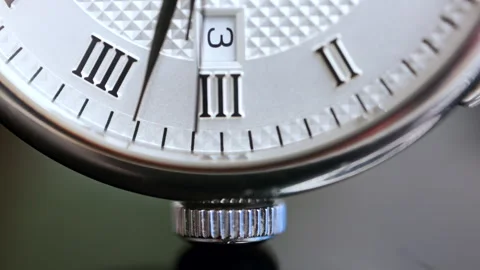 Close up of a silver watch on a blurred background Stock Footage 304260841