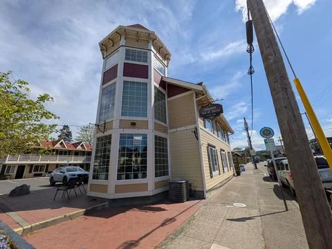 Close-up of Silverton Inn featuring a distinctive glass-windowed tower Stock Photos