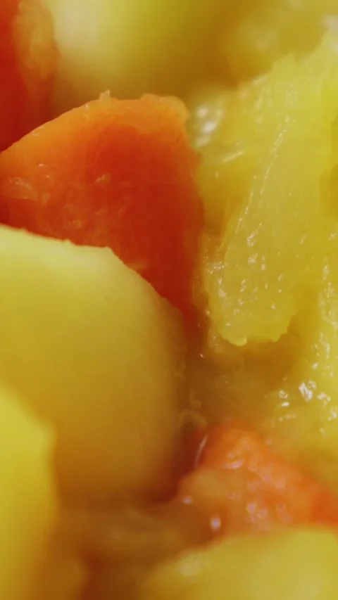 Close-up simmering vegetable stew with bubbling golden broth, carrot and po.. Stock Footage 348419747