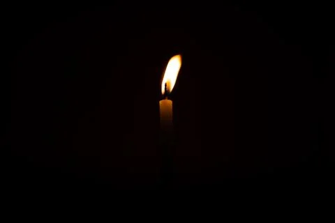 Close Up Single Burning, Bright White Paraffin Candle Light On Isolated Dark Stock Photos
