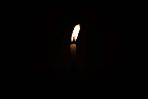 Close Up Single Burning, Bright White Paraffin Candle Light On Isolated Dark Stock Photos