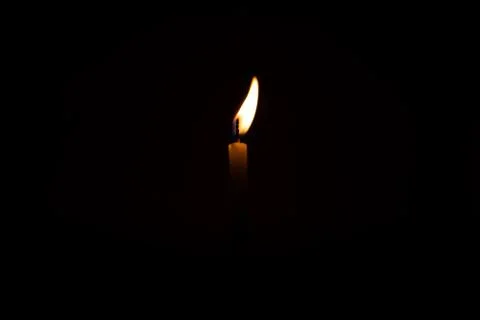 Close Up Single Burning, Bright White Paraffin Candle Light On Isolated Dark Stock Photos