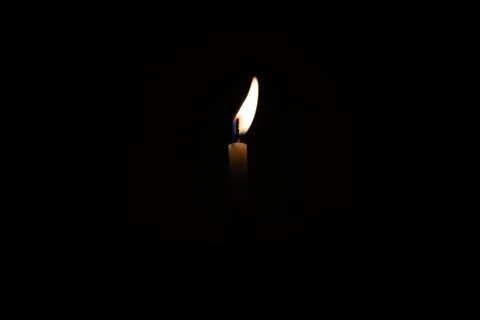Close Up Single Burning, Bright White Paraffin Candle Light On Isolated Dark Stock Photos