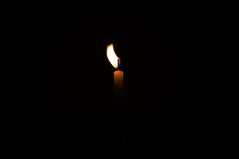 Close Up Single Burning, Bright White Paraffin Candle Light On Isolated Dark Stock Photos
