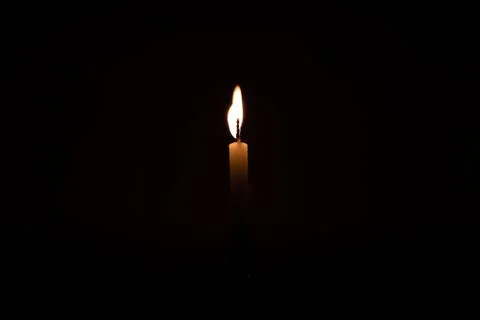 Close Up Single Burning, Bright White Paraffin Candle Light On Isolated Dark Stock Photos