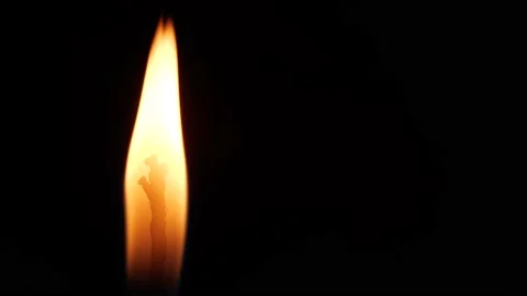 Close-up Single Candle Flame Isolated on Black Background Video stock 137896862