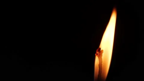 Close-up Single Candle Flame Isolated on Black Background Stock Footage 137896996