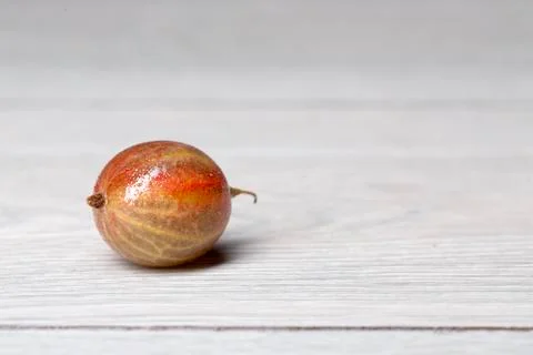 Close up of a single gooseberry on a table Stock Photos