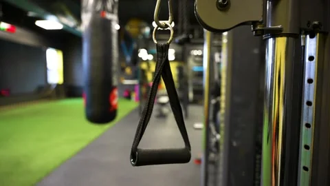 Close up single handle cable attachment in modern studio gym Stock Footage 330620672
