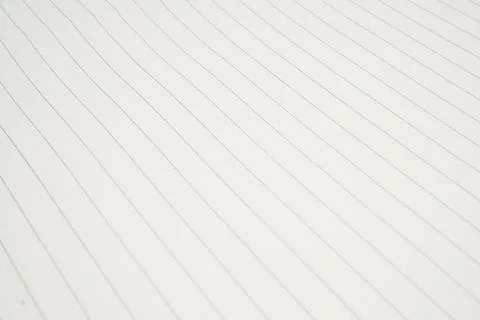 Close up of a single sheet of lined paper used as a background. Stock Photos