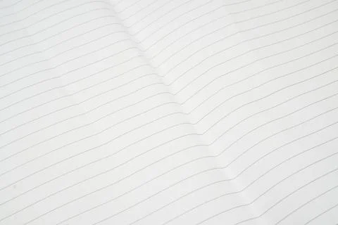Close up of a single sheet of lined paper used as a background. Stock Photos
