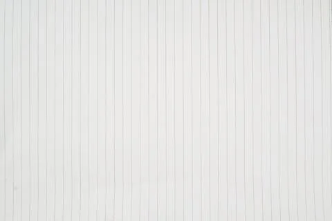 Close up of a single sheet of lined paper used as a background. Stock Photos