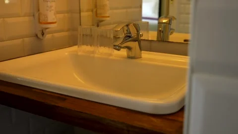 Close up sink, interior bathroom design. Hotel. Panning 4K Video stock 320069604