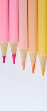 Close-up of six sharp-tipped colored pencils arranged horizontally with col.. Stock Photos