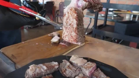 Close-up of Sizzling Beef Steaks and Shrimp Grilling on a Hot Barbecue with Smok Stock Footage 338210939