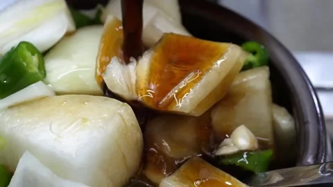 Close-up of Sizzling Korean Stir-Fried Fish Cake (Eomuk Bokkeum) with Onions and Stock Footage 337374175