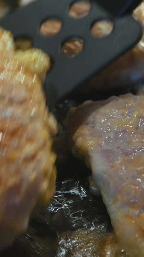 Close-Up Of Sizzling Pork Being Flipped In A Pan. Vertical. Stock-Footage 303483192