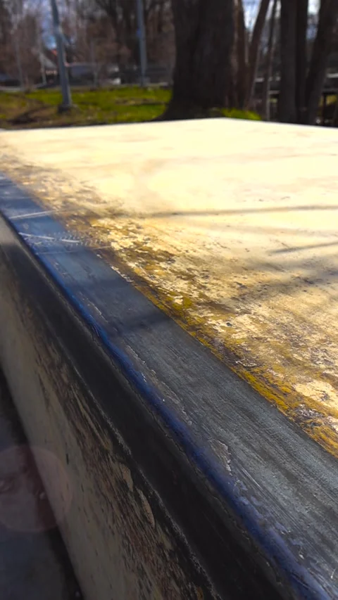 Close up of skateboard tire track marks on worn metal ledge at skatepark. Stock Footage 337771243