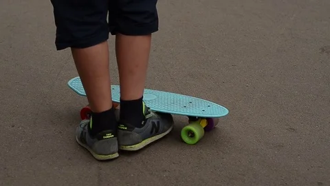 Close up of a skateboarder's feet while skating Stock Footage 72076272