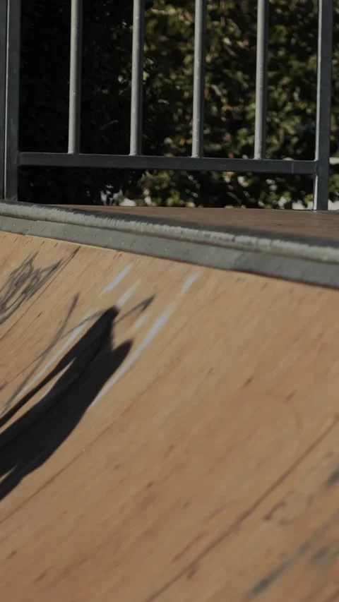 Close Up of Skater Doing Axle Stall Trick on Ramp Coping Stock Footage 317991554