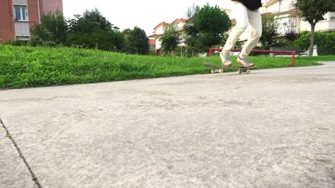 Close-Up of a Skater's Legs Performing a Flip Trick in Slow Motion 4K Stock Footage 285765921