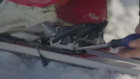 Close-up ski being screwed with screwdriver Stock Footage 346056080