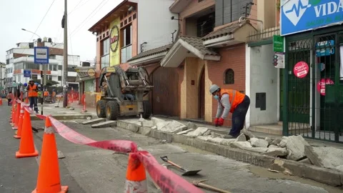 Close-up of a skid steer loader with hydraulic hammer breaking and demolishing Stock Footage 160376387