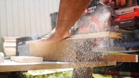 Close up of Skill Saw Cutting Wood with Saw Dust Stock Footage 104889864