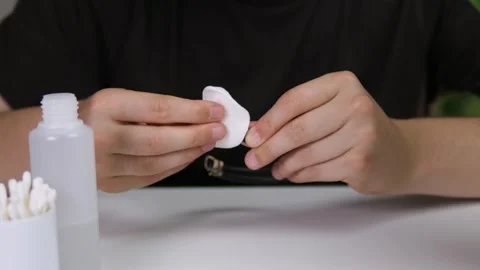 Close-up of skilled hands meticulously cleaning and polishing a bracelet with a Stock Footage 316296775