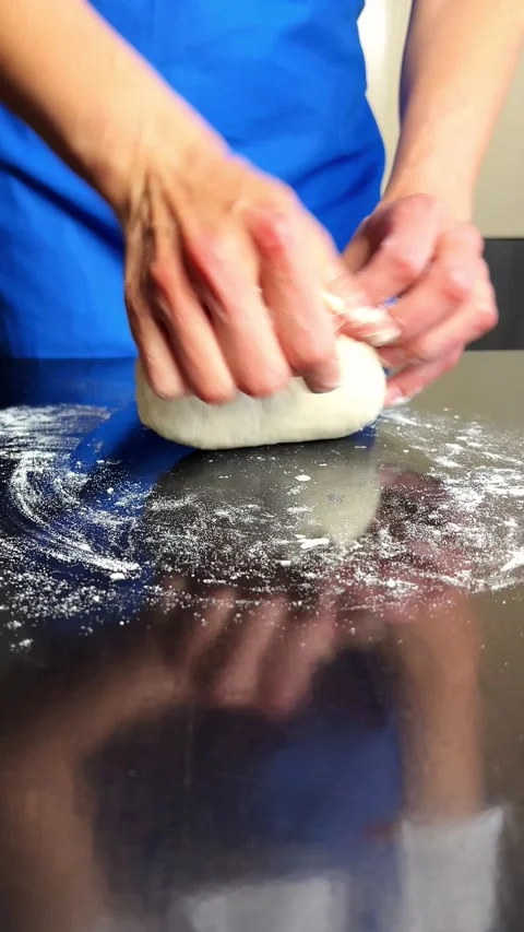 Close up of skilled hands shaping rustic sourdough. Organic ingredients Stock Footage 315102139