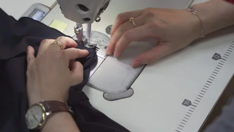 Close-up of Skilled Hands of Tailors and Sewing Machines in Vietnam, Asia Video stock 247416466