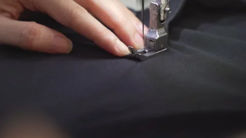 Close-up of Skilled Hands of Tailors and Sewing Machines in Vietnam Video stock 247416690