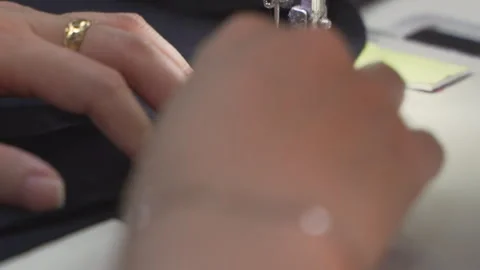Close-up of Skilled Hands of Tailors and Sewing Machines in Vietnam Video stock 247417228