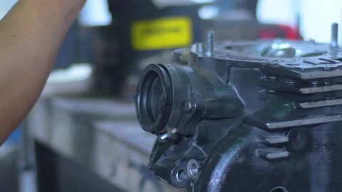 Close up Skilled Labourer engine overhaul Stock Footage 312202184